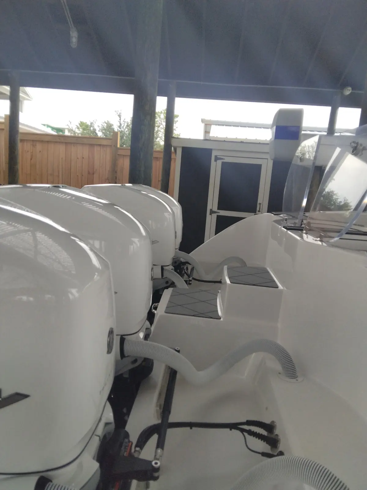 Clean white boat transom and deck at the marina
