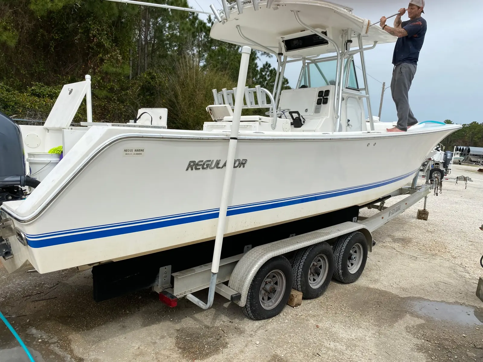 White center-console boat serviced by Riviera Shine Medics