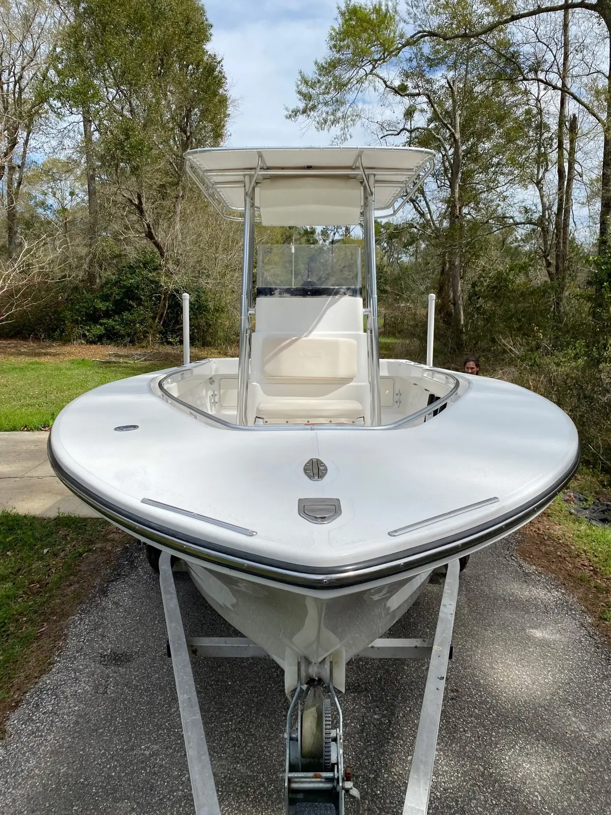 Clean white center-console boat viewed from the bow