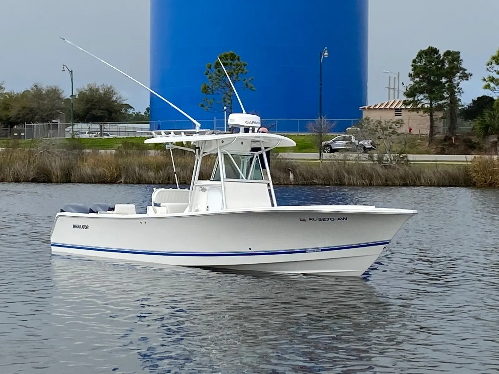 White center-console boat with a renewed finish on the water