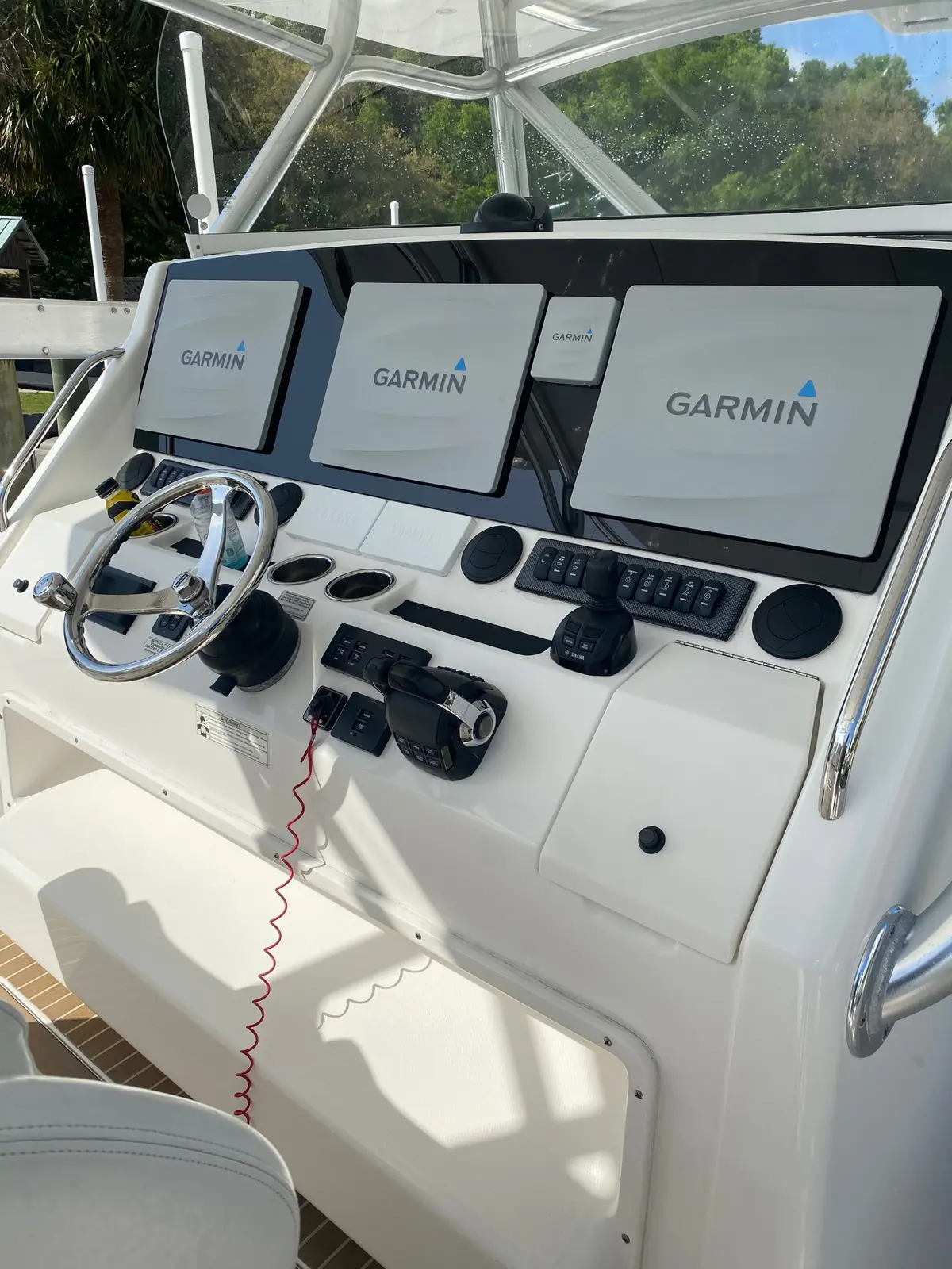 Clean boat helm with Garmin displays and polished controls